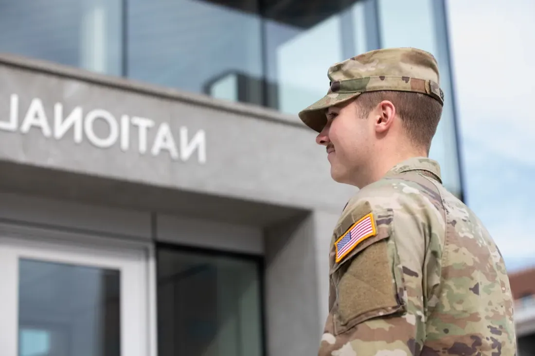 A student in ROTC uniform outside the Veterans Building.